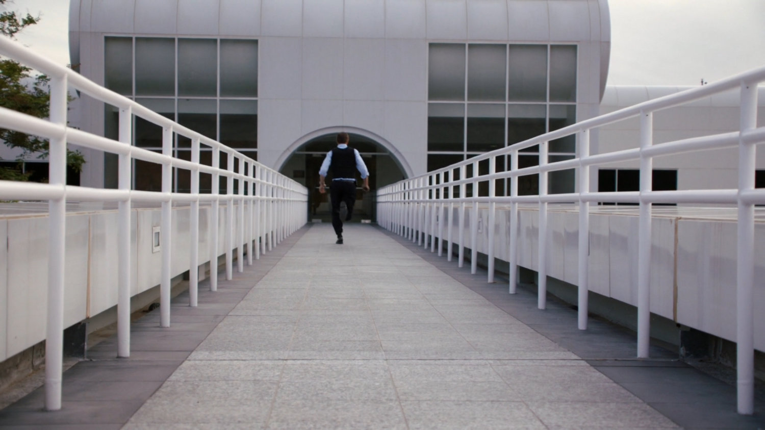 Coulson running across a walkway at the Cybertek Manufacturing Facility.