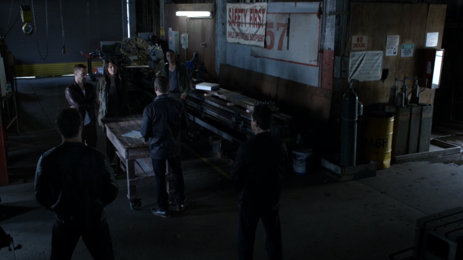 Wide shot of sale inside old warehouse.