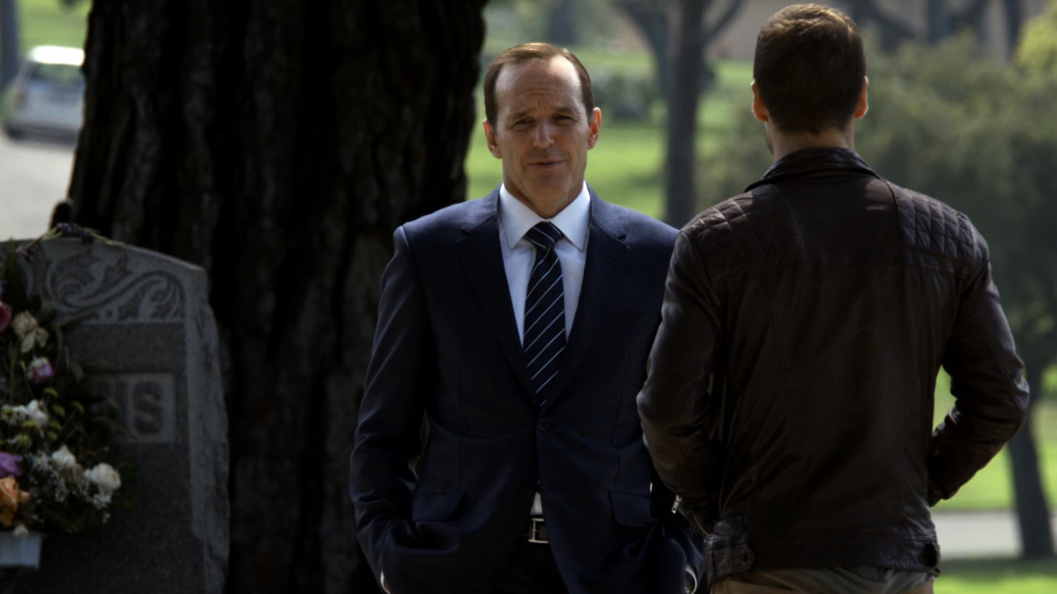 Hunter and Coulson in cemetery.