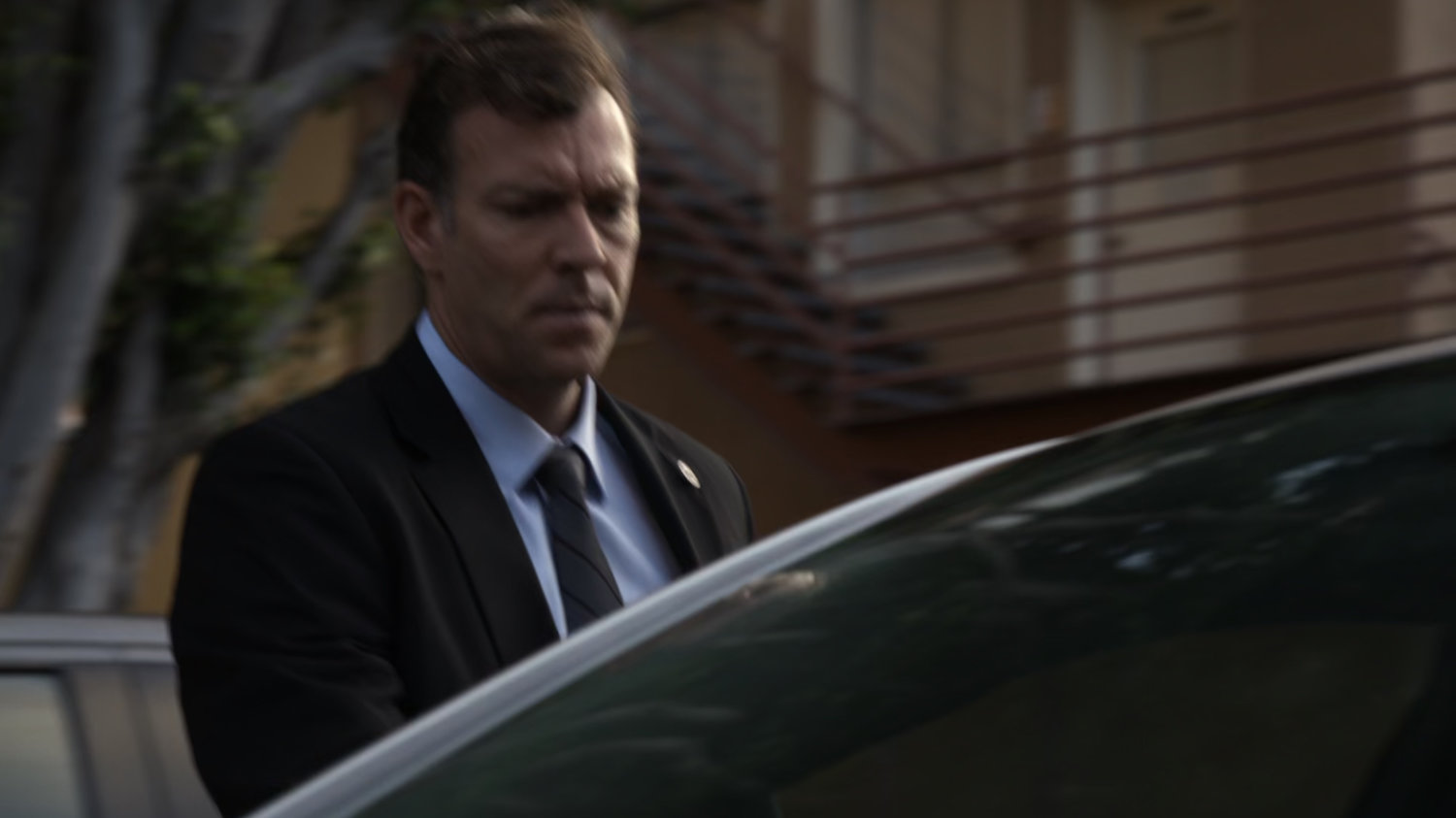 Man getting into Raina's car.