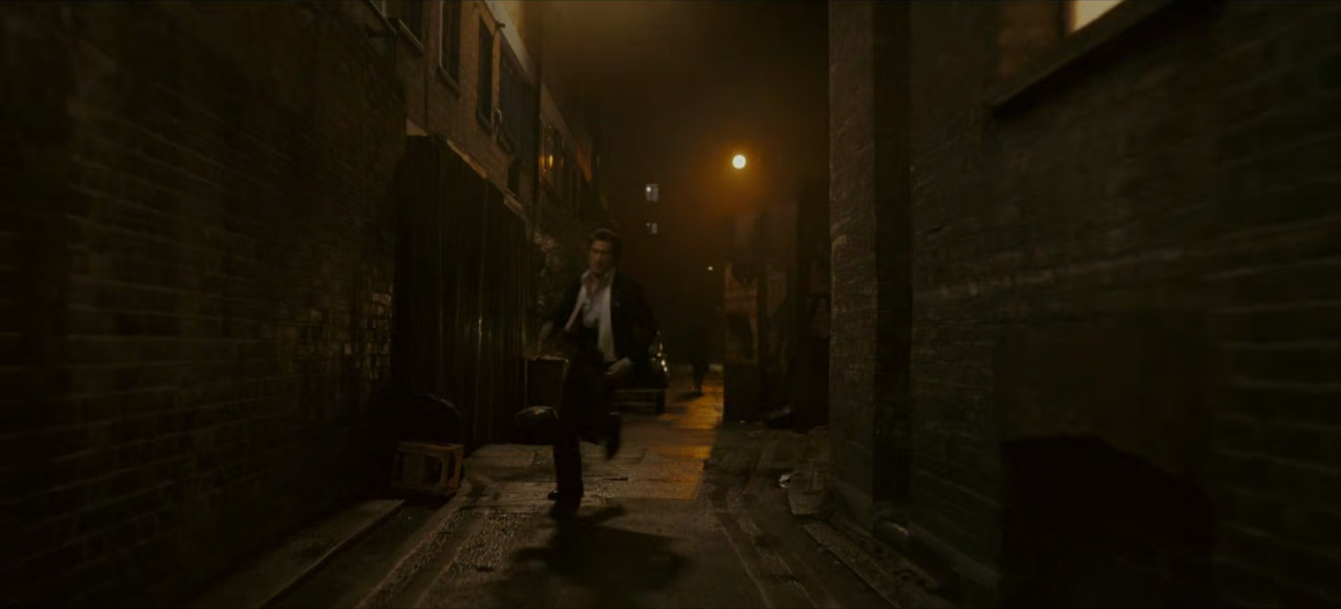 Brad runs through a dark alley.