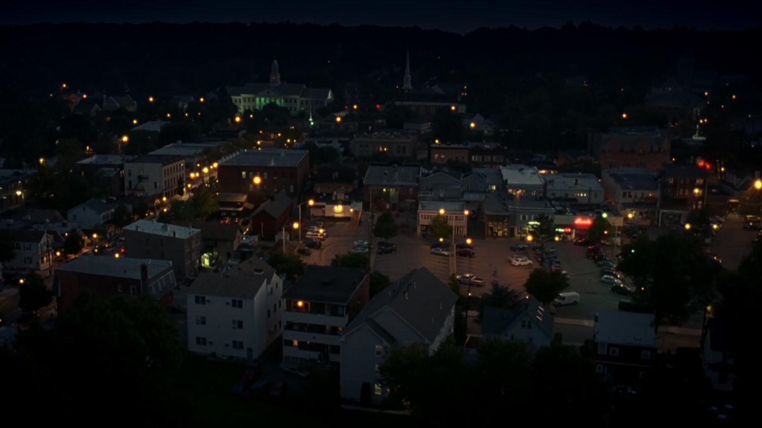 Aerial nighttime shot of town.