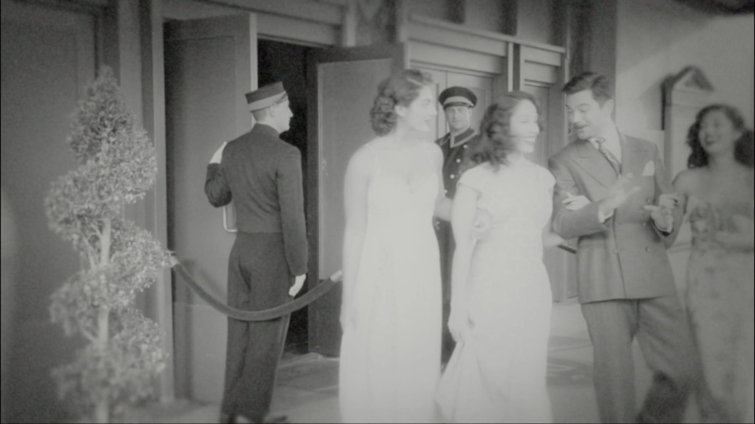 Howard Stark exits theater with three women.
