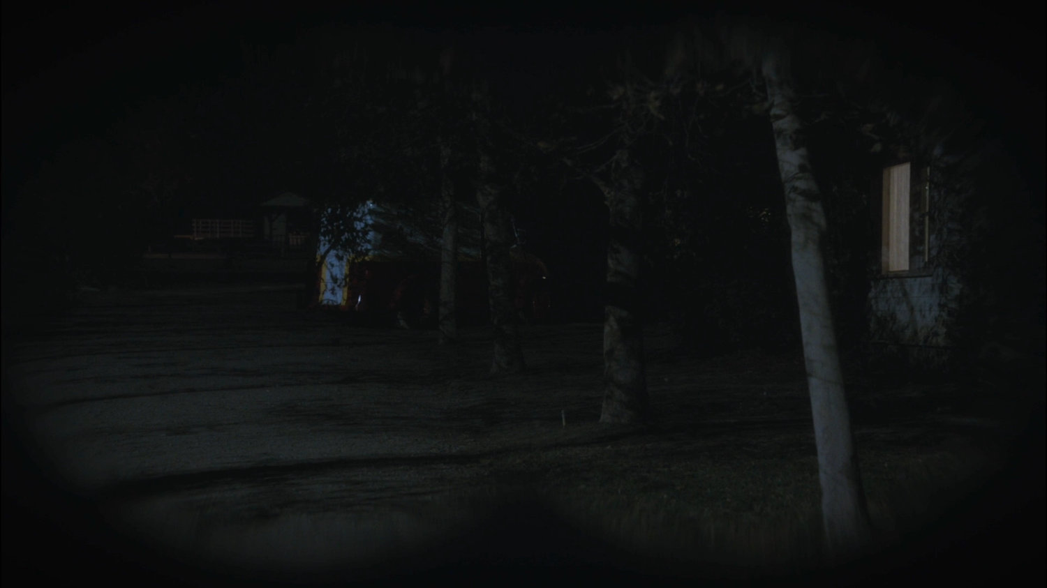 Nighttime exterior of Sheldon McFee house with Milk Truck parked behind it.