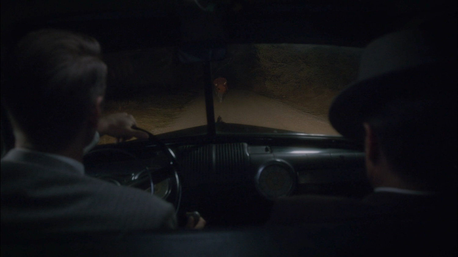 Thompson and Dooley pull Sheldon McFee over on dirt road.