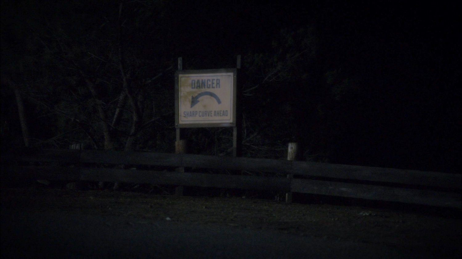 Dangerous curve in New Jersey road. Sign: Danger, Sharp Curve Ahead.