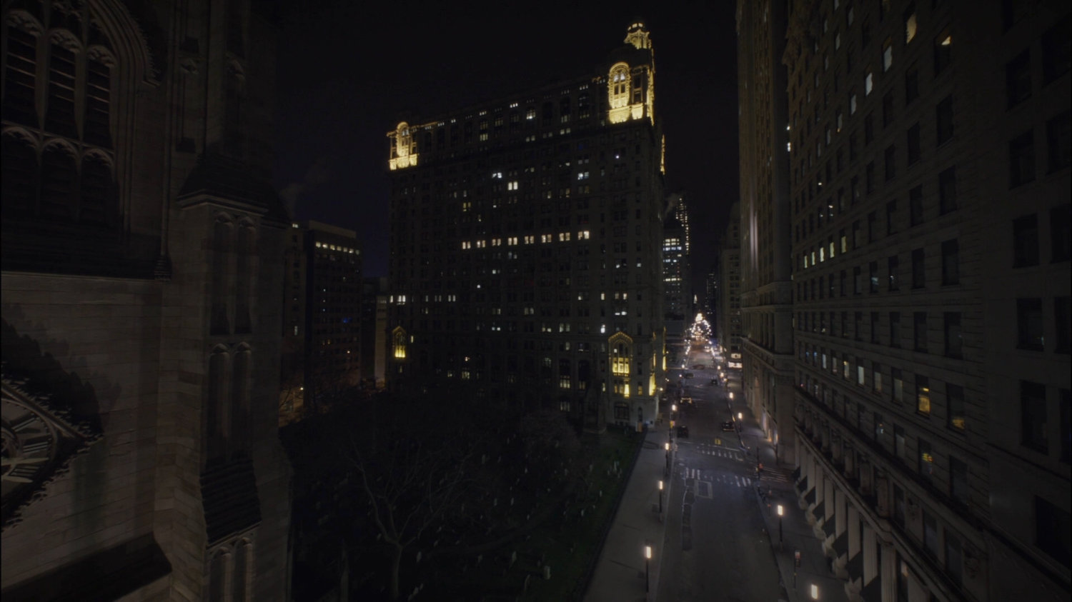 Nighttime shot of Trinity Church and Stark Penthouse.