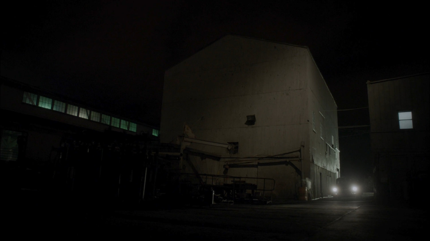 A car drives into alley of Dock 12.