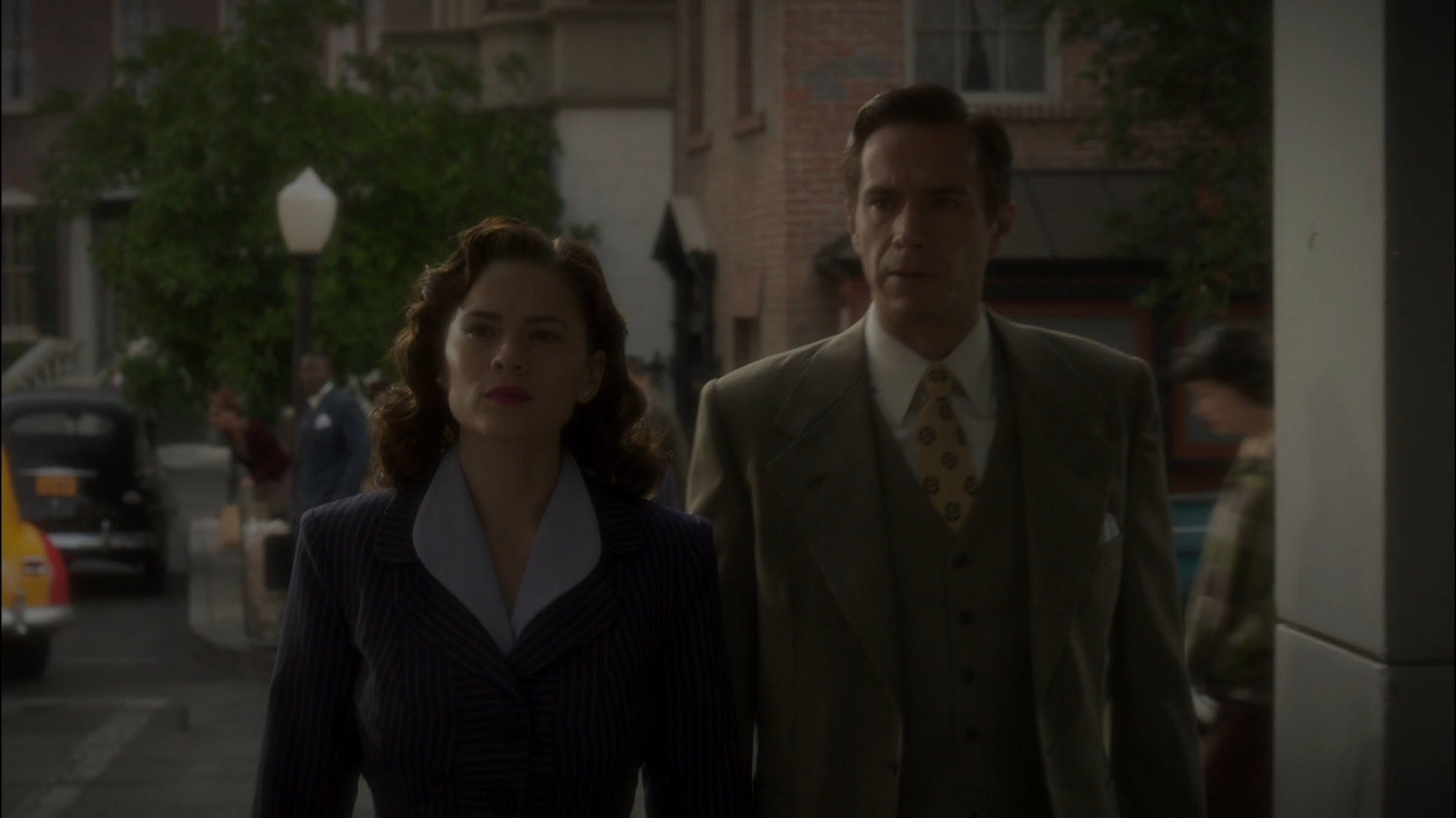 Peggy and Jarvis on a sidewalk in New York city.