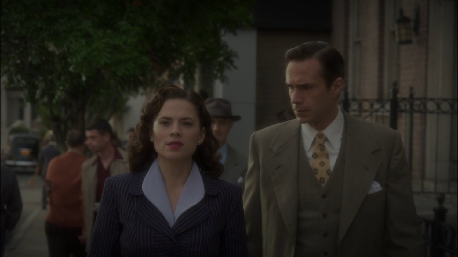 Peggy and Jarvis on a sidewalk in New York city.