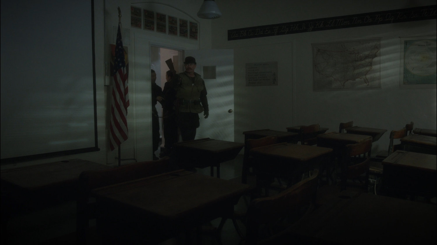 Dum Dum Dugan enters a derelict classroom.