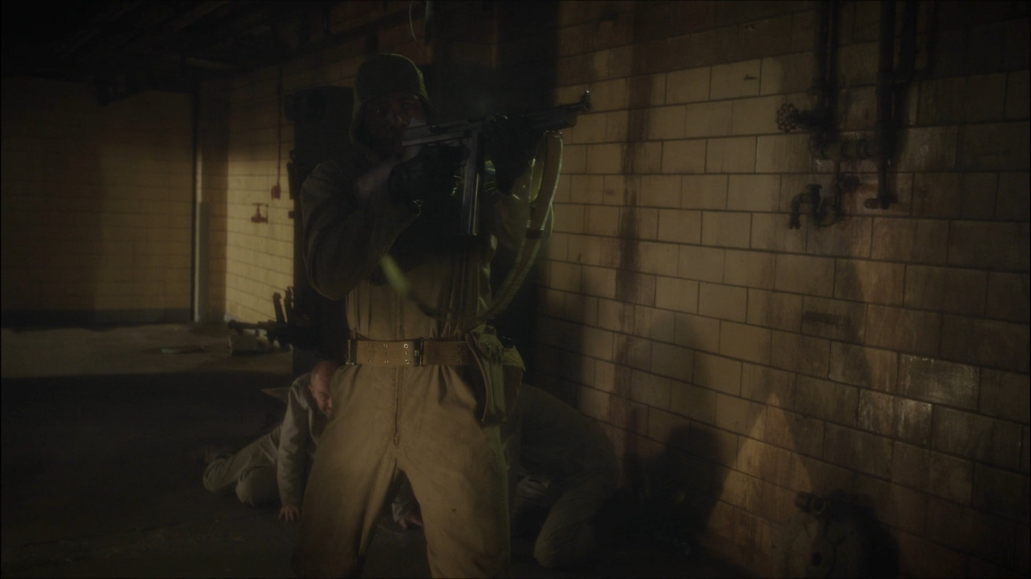 Happy Sam Sawyer firing rifle in Belarus prison.