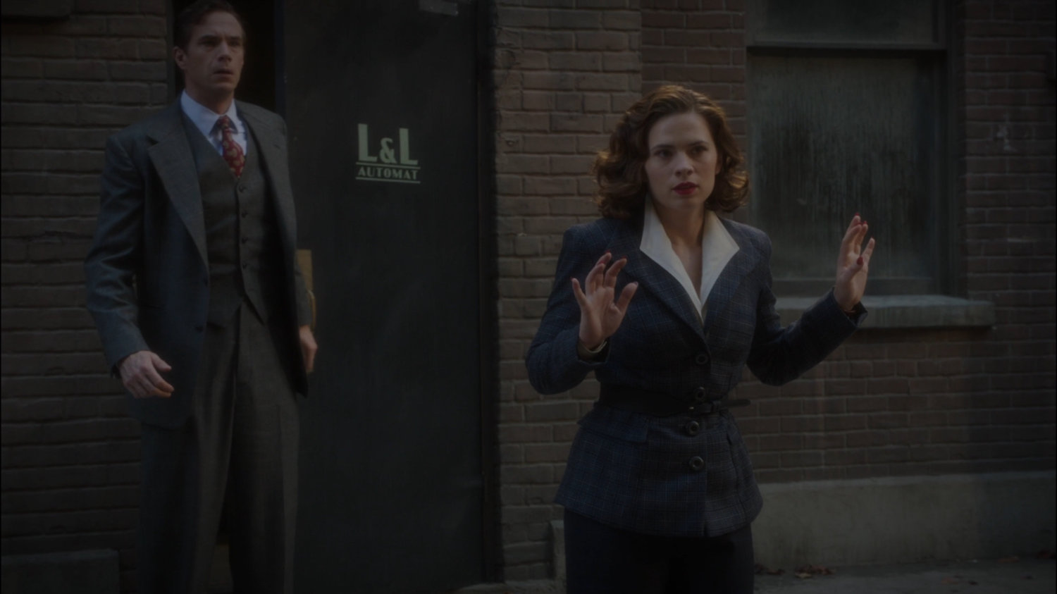 Jarvis and Peggy in alley behind Automat.