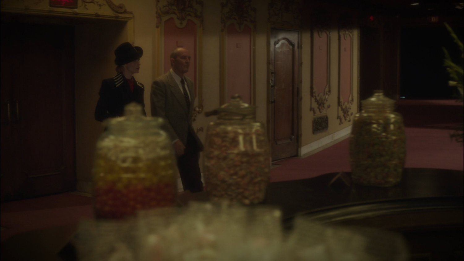 Dottie and Dr Ivchenko in movie theater lobby.