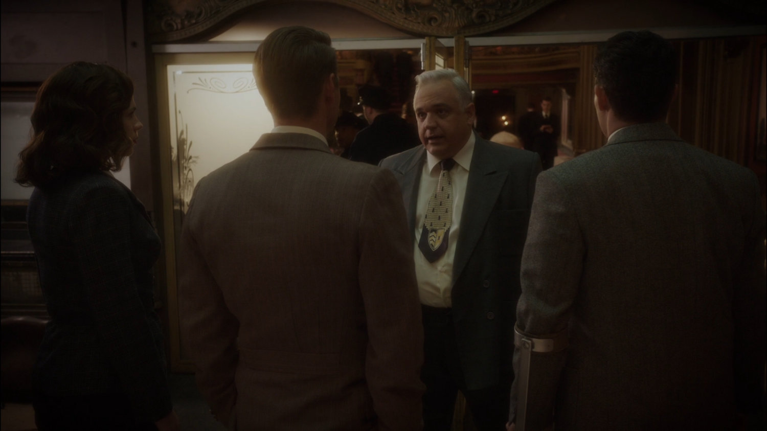 SSR Agents talk to manager of New York movie theater.