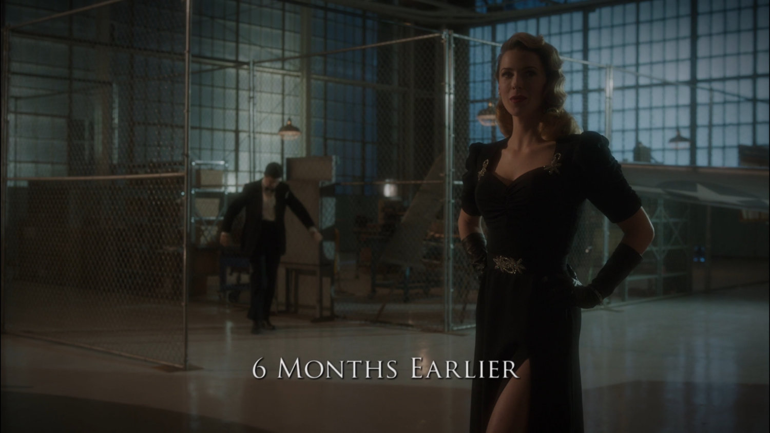 Howard and Dottie in Howard Stark's airplane hangar. Text: 6 months earlier.