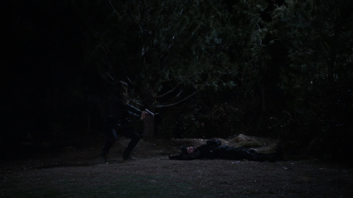 Bobbi and Agent Calderon in the woods outside Fury's cabin.