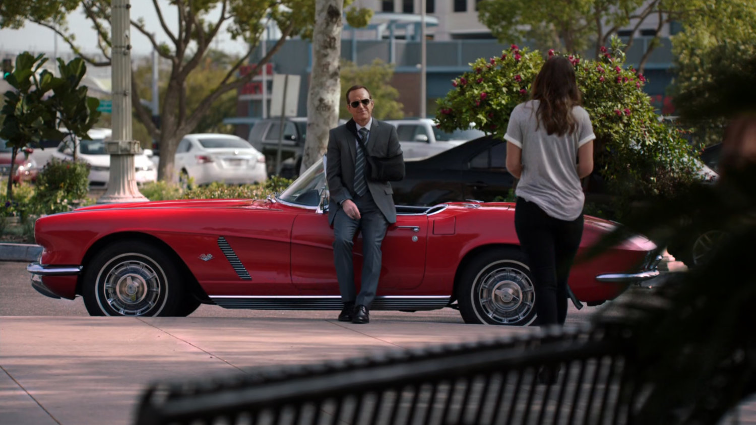 Skye walks towards Coulson and Lola outside the Winslow Veterinary Clinic.