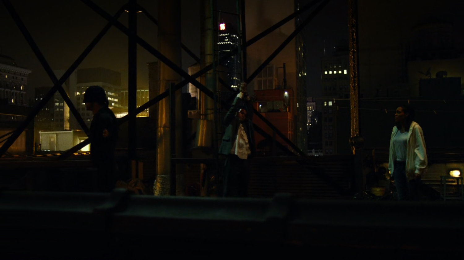 Matt interrogates mobster on rooftop of Claire's Apartment building.