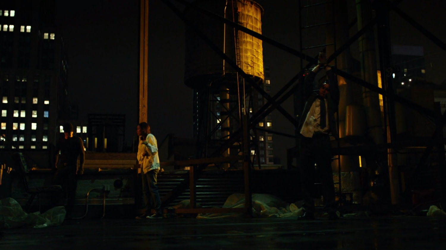 Matt interrogates mobster on rooftop of Claire's Apartment building.