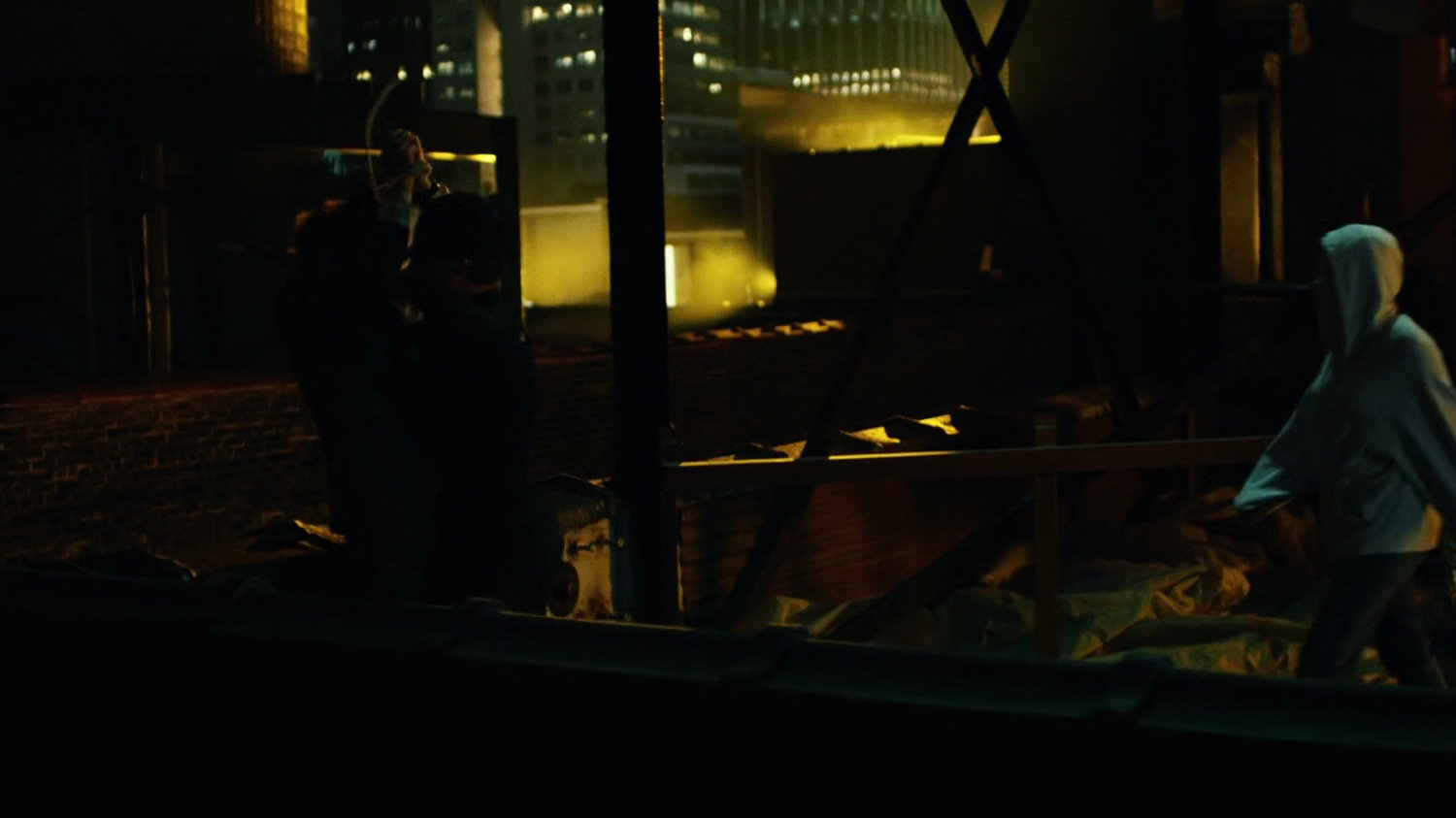 Matt interrogates mobster on rooftop of Claire's Apartment building.