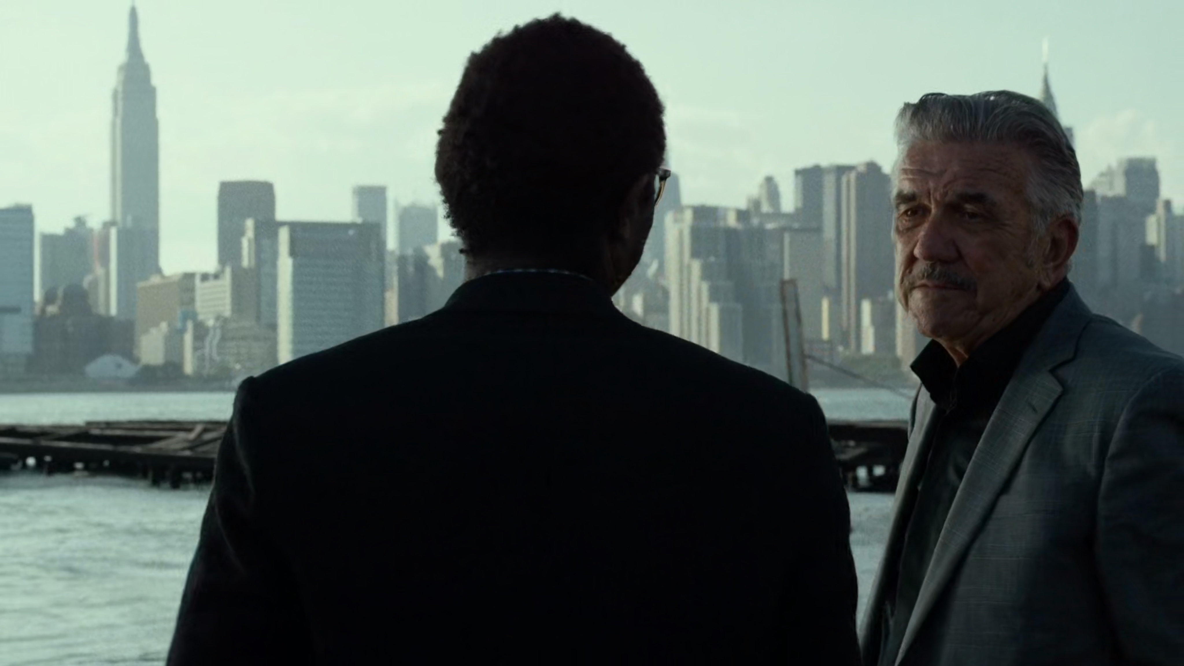 Ben and Silvio talk in river side lot.