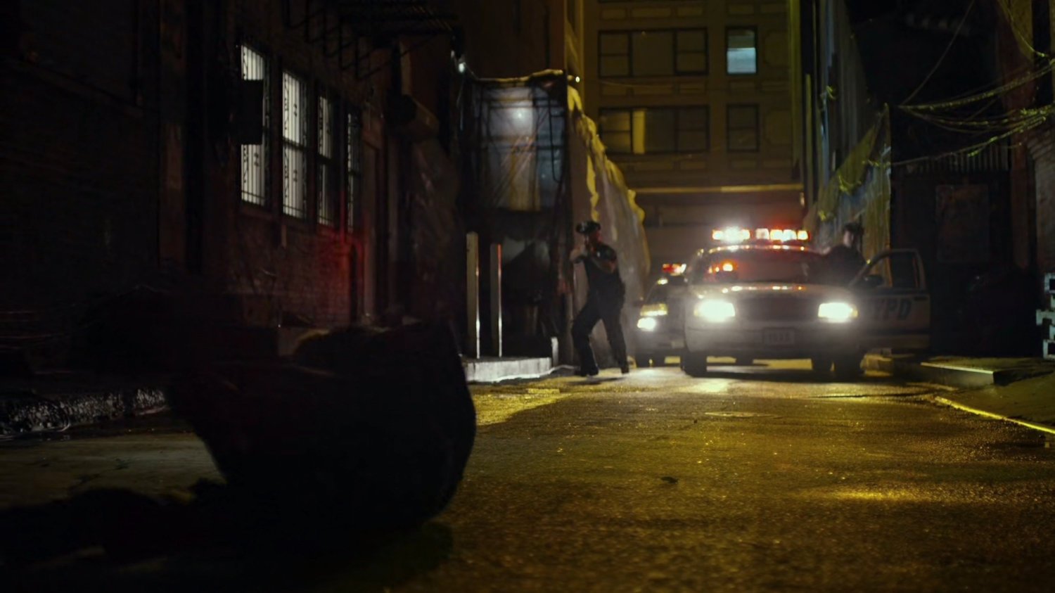 Police in alley behind Madame Gao's warehouse.