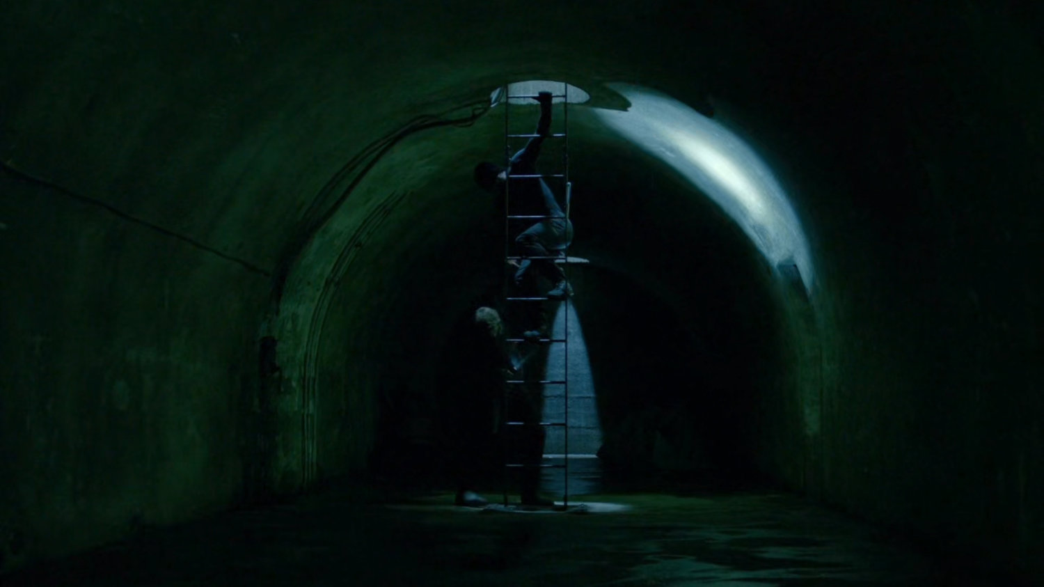Daredevil and Vladimir enter access tunnels under an abandoned warehouse.