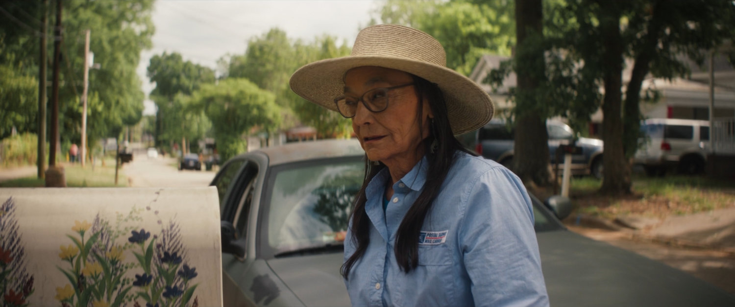 Chula delivering mail and looking at intersection in Tamaha.