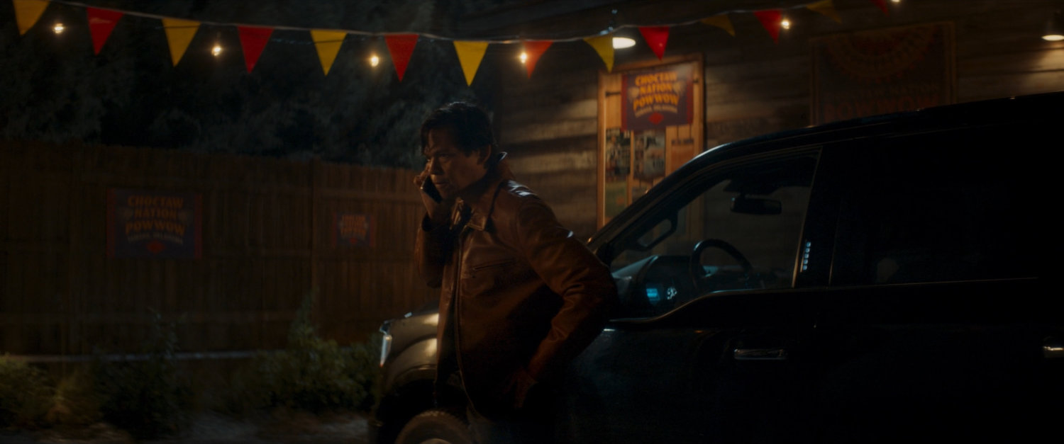 Henry on the phone outside the Choctaw Nation PowWow at night.