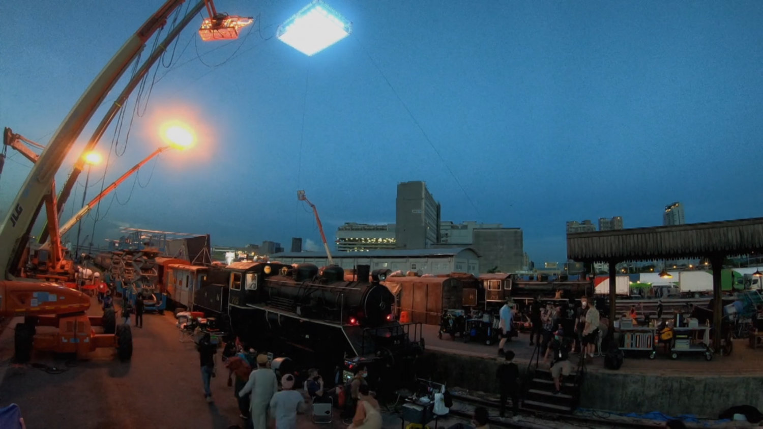 Behind-the-scenes view of filming at the Indian Railways Train Station location.