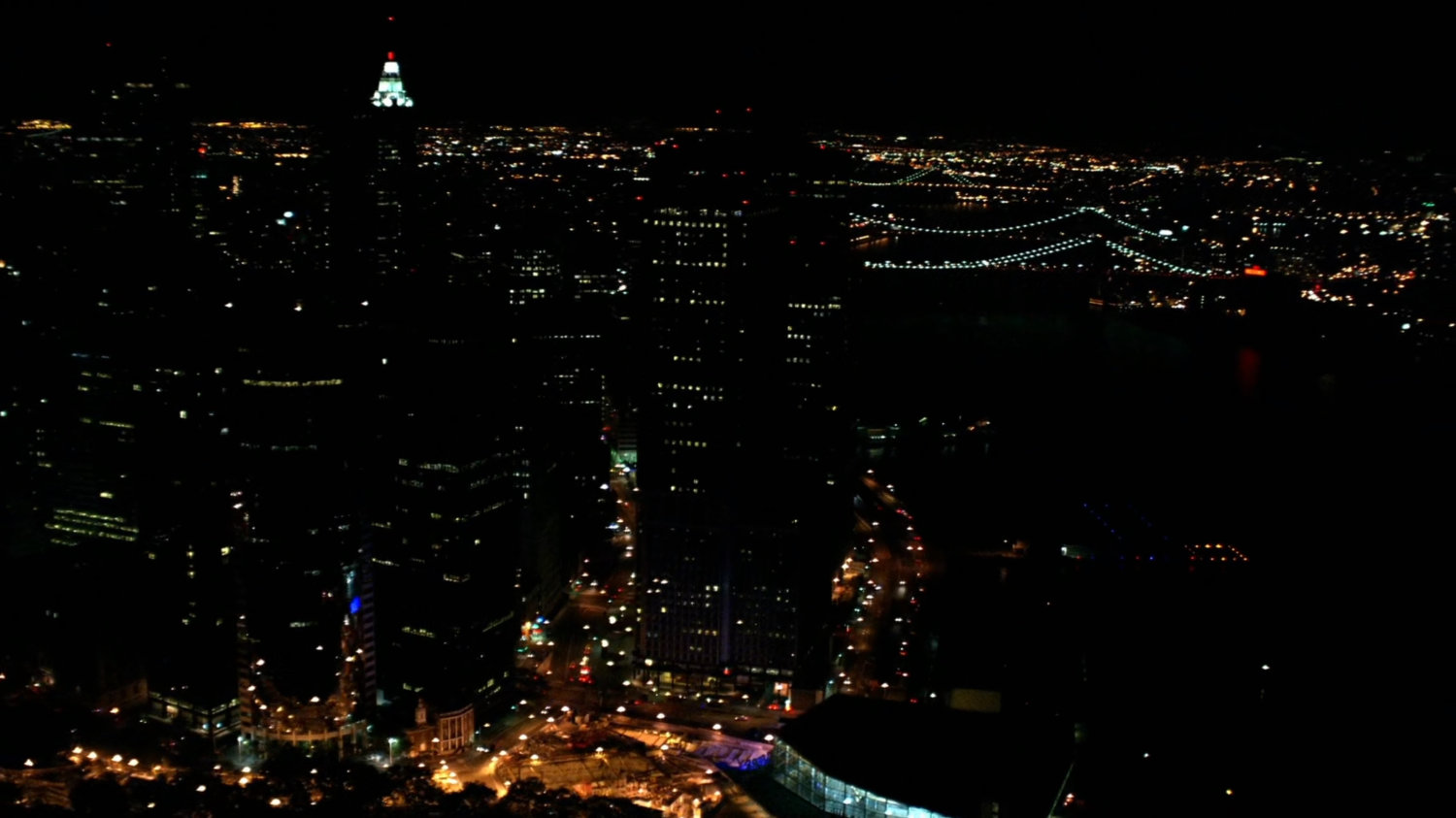 Nighttime aerial of Manhattan.
