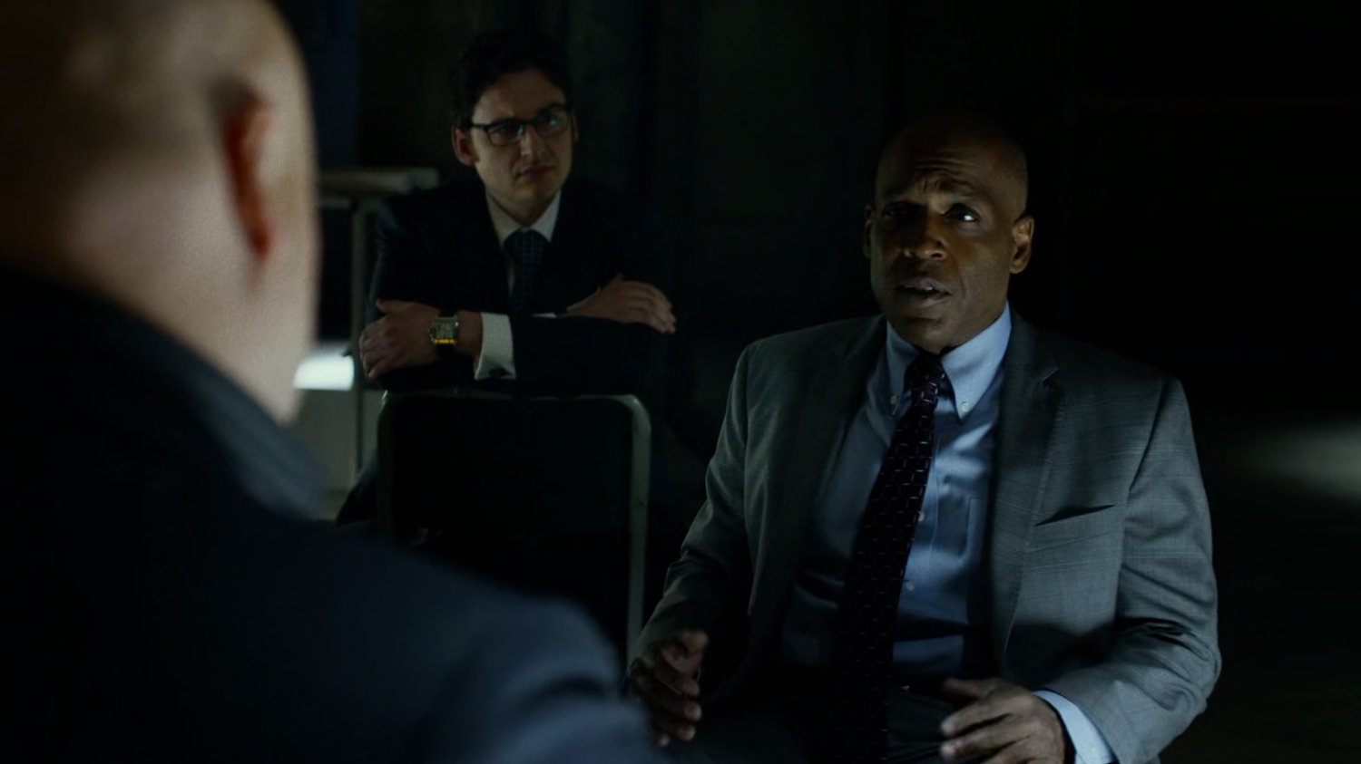 Fisk, Wesley, and Hoffman meet inside warehouse at Pier 81.