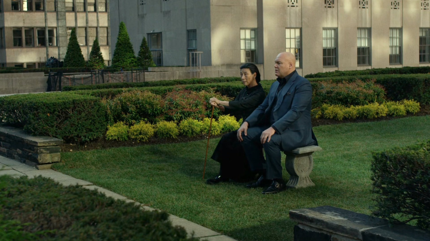 Fisk and Madame Gao on rooftop garden.