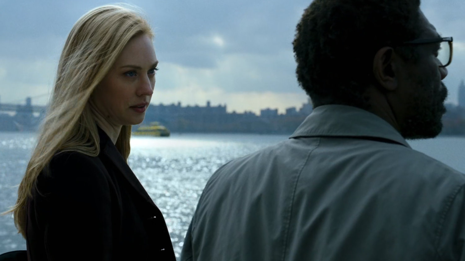 Karen and Ben standing by the East River.