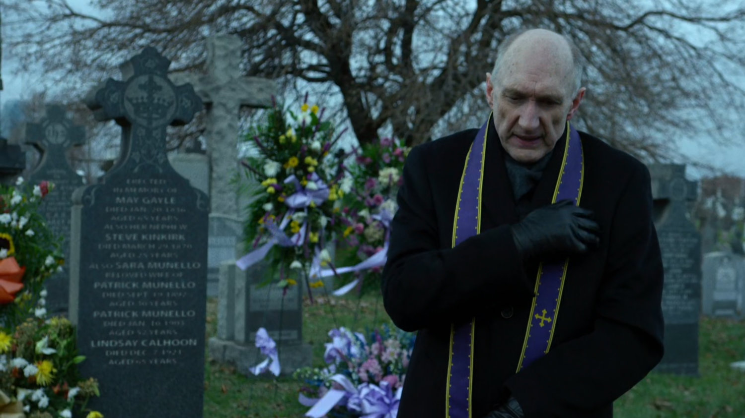 Father Lantom at cemetery.