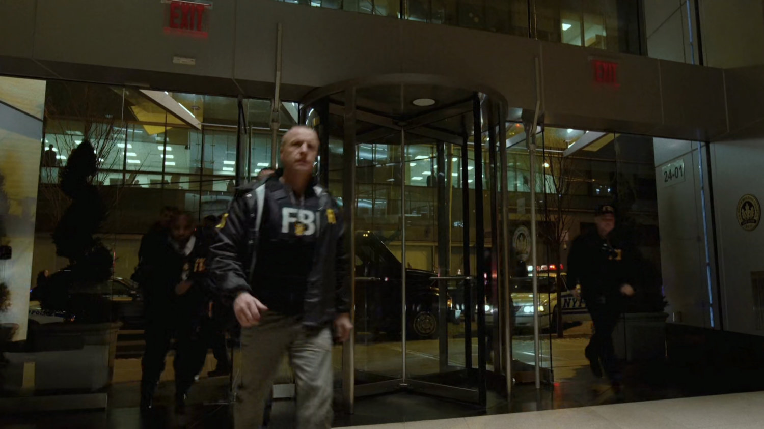 FBI agents entering Fisk's building.
