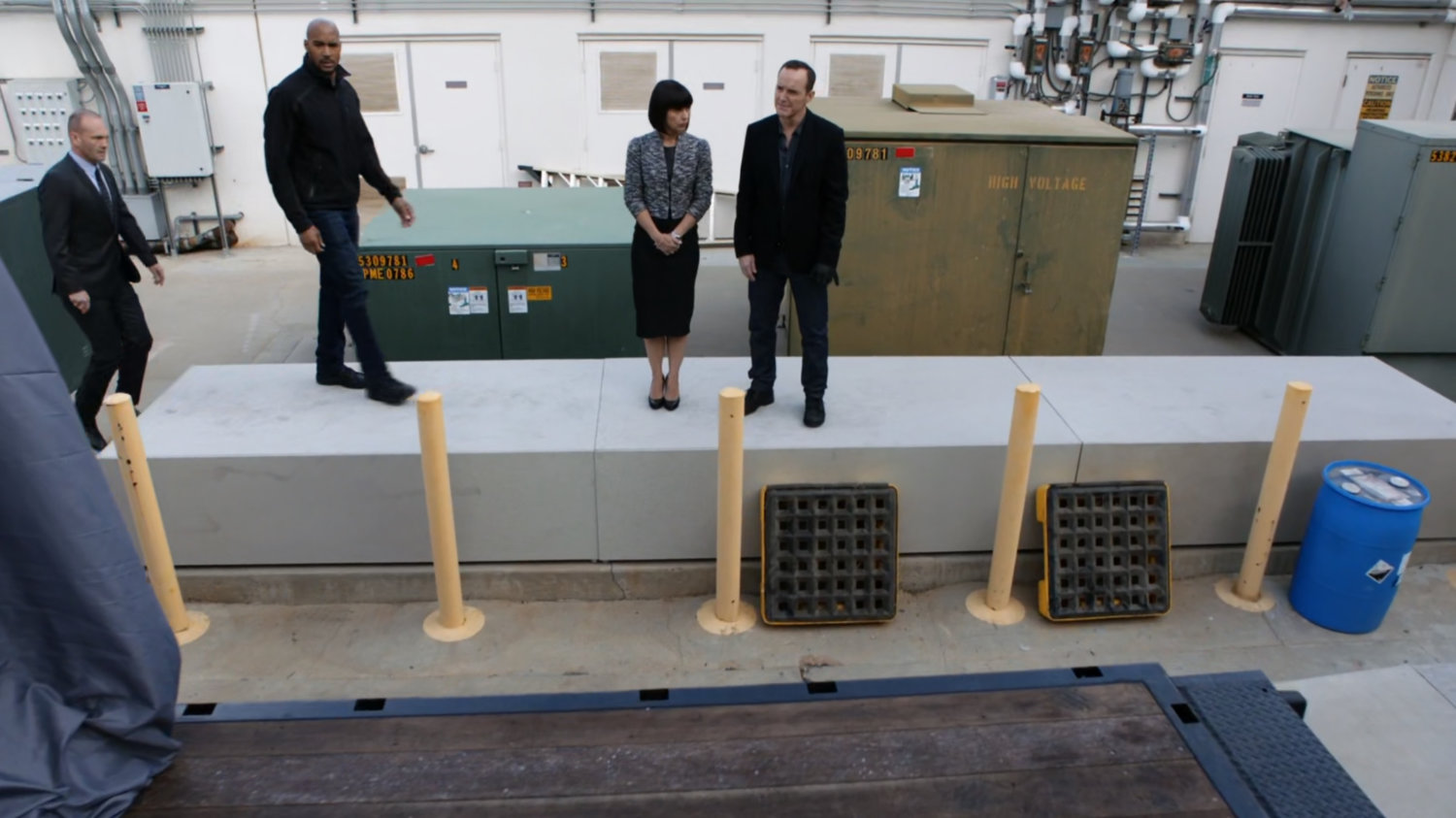 Banks, Mack, Rosalind, and Coulson outside a loading dock in Maryland.