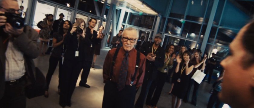 "Larry King," actually a Stan Lee cameo, with crowds inside the hallways at Stark Expo.