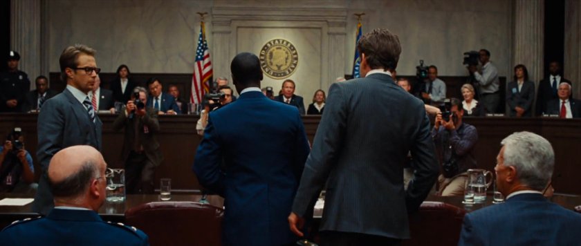 Tony Stark and a crowd inside the Senate chambers.