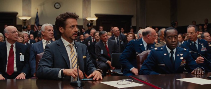 Tony Stark and a crowd inside the Senate chambers.