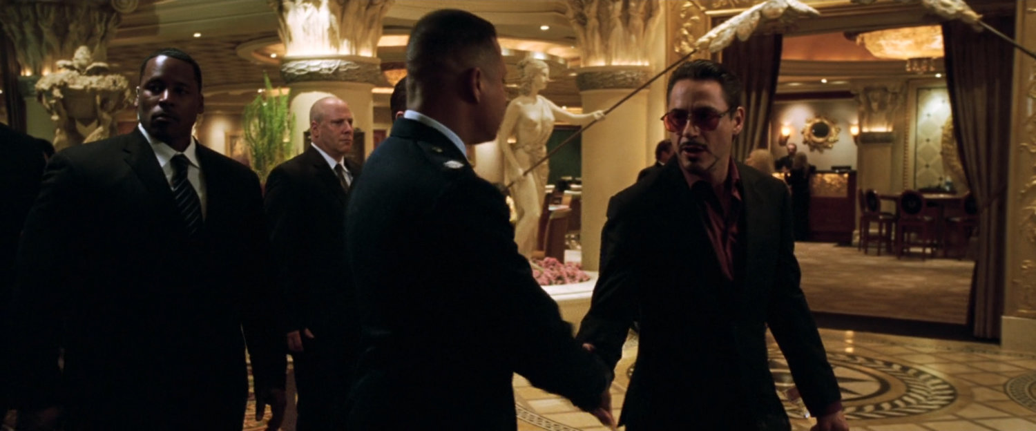 Tony Stark shakes Colonel Rhodes hand in Caesar's Palace casino.