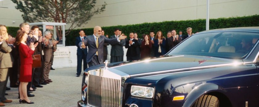 Obidiah Stane welcomes a limo outside Stark International.