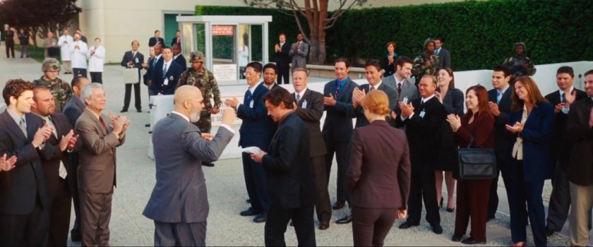 Obidiah Stane welcomes Tony Stark outside Stark International.