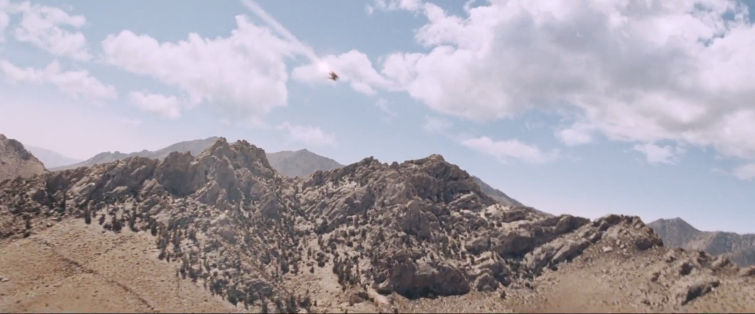 Desert hills with white clouds in the sky.