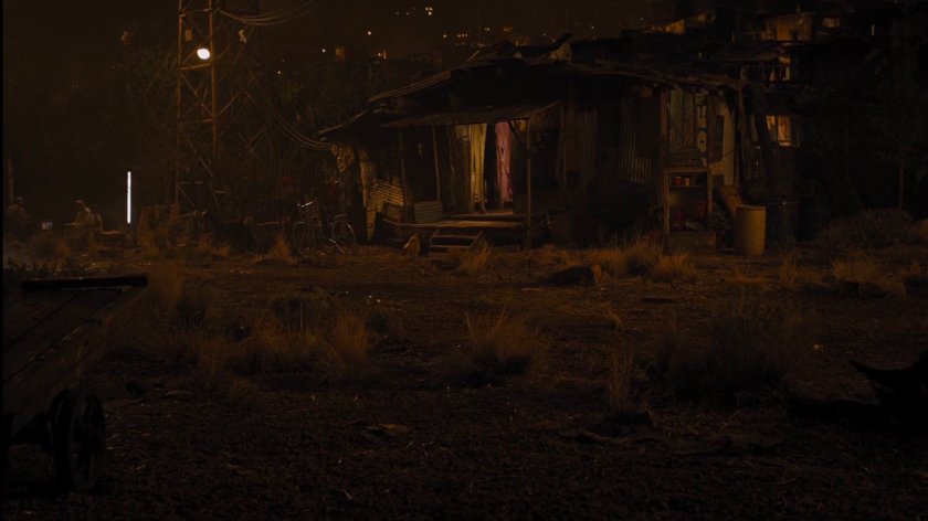 Nighttime view of shack in Indian slum.