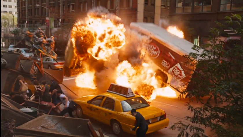 A Dr Pepper truck explodes in a city street.