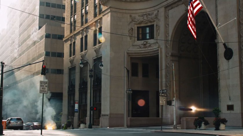 Iron Man flies out of a tunnel in the Helmsley Building.