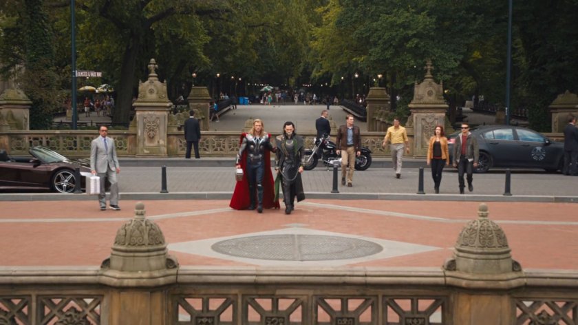 Thor and the Avengers lead Loki across a street to the Bethesda Terrace in Central Park.