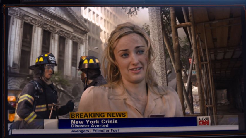 A waitress is interviewed by TV news outside the bank where she was held hostage.